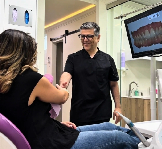 Dentist consulting a patient in a modern dental clinic.